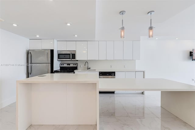 5701 Collins Ave Unit 1611, Miami Beach, FL 33140 - kitchen with stainless steel appliances, modern cabinets, light marble finish flooring, white cabinets, and hanging light fixtures
