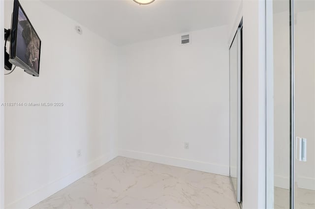 5701 Collins Ave Unit 1611, Miami Beach, FL 33140 - empty room featuring light marble finish floors and baseboards