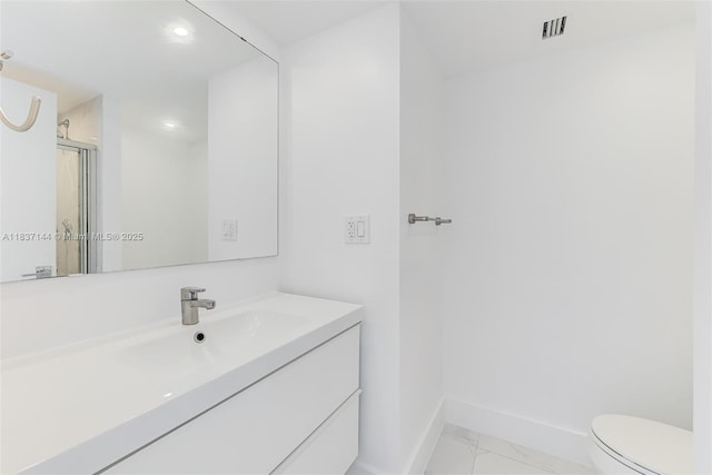 5701 Collins Ave Unit 1611, Miami Beach, FL 33140 - bathroom featuring marble look tiles, vanity, an enclosed shower, and recessed lighting