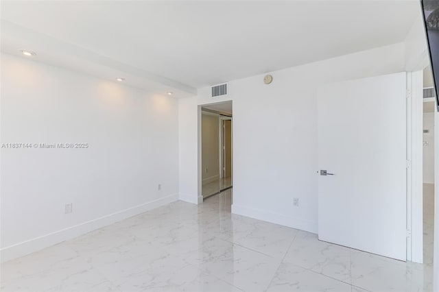 5701 Collins Ave Unit 1611, Miami Beach, FL 33140 - unfurnished room featuring light marble finish floors, recessed lighting, and a smoke detector