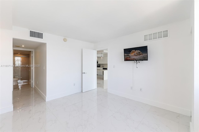 5701 Collins Ave Unit 1611, Miami Beach, FL 33140 - unfurnished room with light marble finish flooring and a smoke detector
