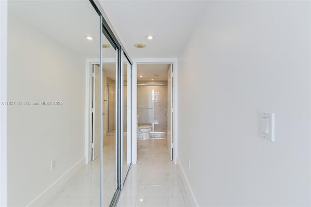 5701 Collins Ave Unit 1611, Miami Beach, FL 33140 - corridor with light marble finish floors and recessed lighting