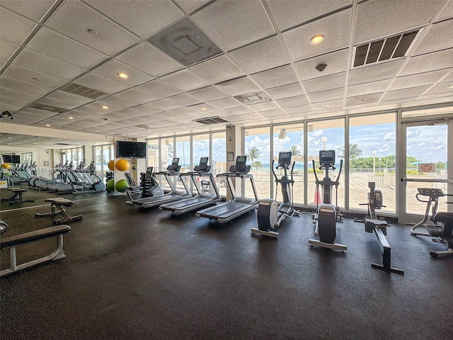5701 Collins Ave Unit 1611, Miami Beach, FL 33140 - gym featuring expansive windows and a paneled ceiling
