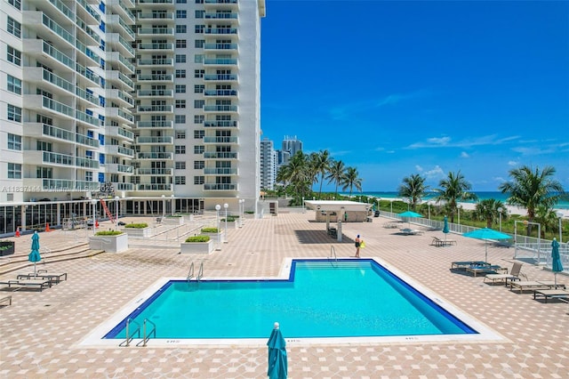 5701 Collins Ave Unit 1611, Miami Beach, FL 33140 - community pool with a patio and a water view