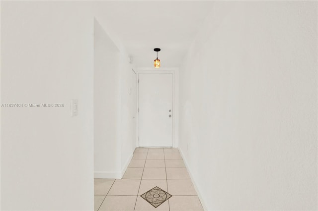 1990 W 56th St Unit 1407, Hialeah, FL 33012 - hallway with light tile patterned floors and baseboards