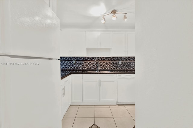 1990 W 56th St Unit 1407, Hialeah, FL 33012 - kitchen featuring white appliances, light tile patterned floors, white cabinetry, decorative backsplash, and dark countertops