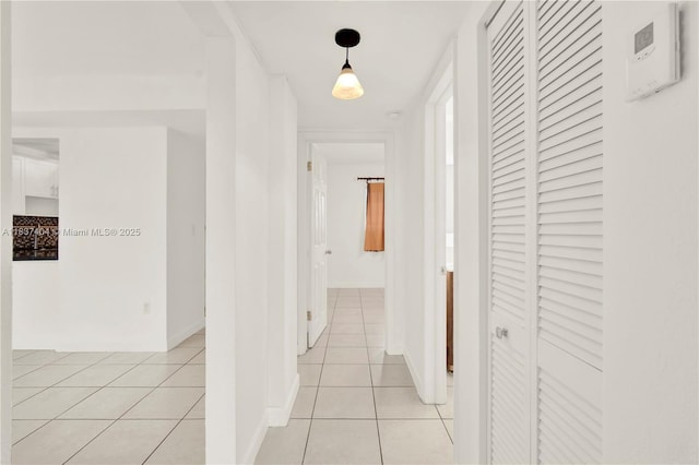 1990 W 56th St Unit 1407, Hialeah, FL 33012 - hallway with light tile patterned floors and baseboards