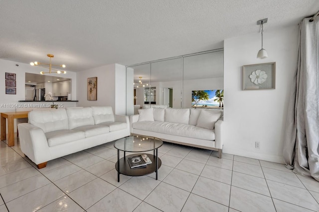 1717 N Bayshore Dr Unit A-3237, Miami, FL 33132 - living area featuring light tile patterned floors, a textured ceiling, and a chandelier