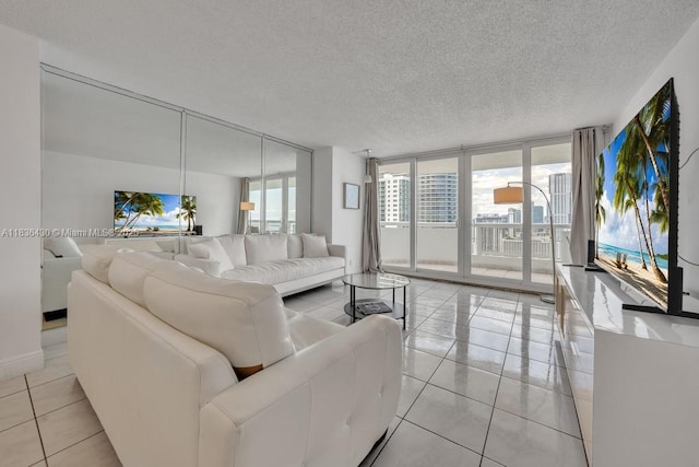 1717 N Bayshore Dr Unit A-3237, Miami, FL 33132 - living area with floor to ceiling windows, light tile patterned floors, and a textured ceiling