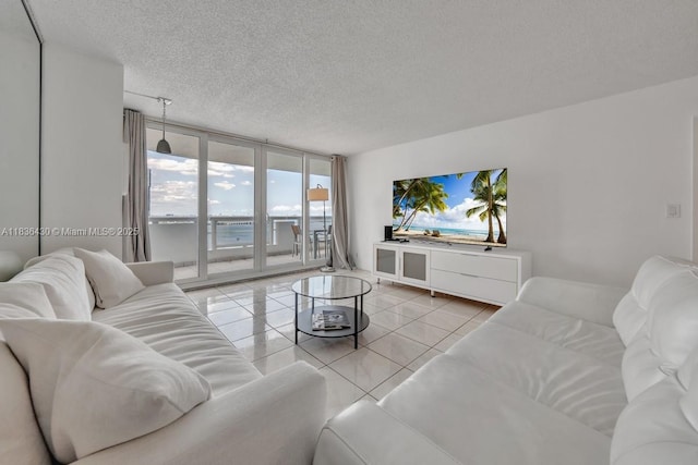 1717 N Bayshore Dr Unit A-3237, Miami, FL 33132 - living room featuring floor to ceiling windows, a textured ceiling, and light tile patterned floors