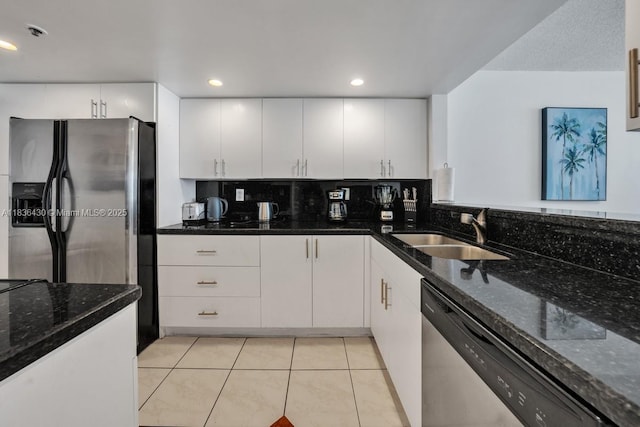 1717 N Bayshore Dr Unit A-3237, Miami, FL 33132 - kitchen featuring stainless steel appliances, white cabinets, dark stone counters, light tile patterned flooring, and recessed lighting