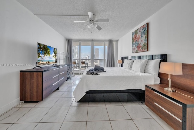 1717 N Bayshore Dr Unit A-3237, Miami, FL 33132 - bedroom featuring a textured ceiling, light tile patterned floors, ceiling fan, and floor to ceiling windows