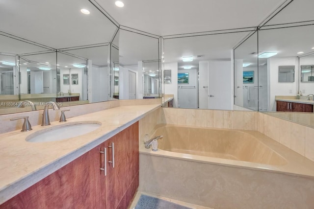 1717 N Bayshore Dr Unit A-3237, Miami, FL 33132 - bathroom featuring a garden tub, vanity, and recessed lighting