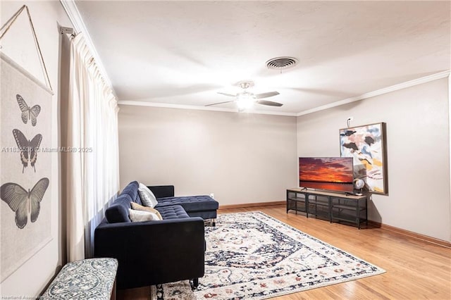 2600 Lakeview Dr, Sebring, FL 33870 - living room featuring wood finished floors, ceiling fan, and crown molding