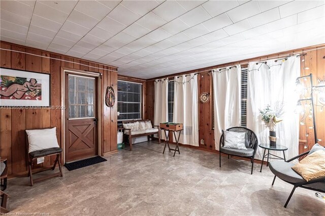 2600 Lakeview Dr, Sebring, FL 33870 - sitting room with wood walls and tile patterned floors