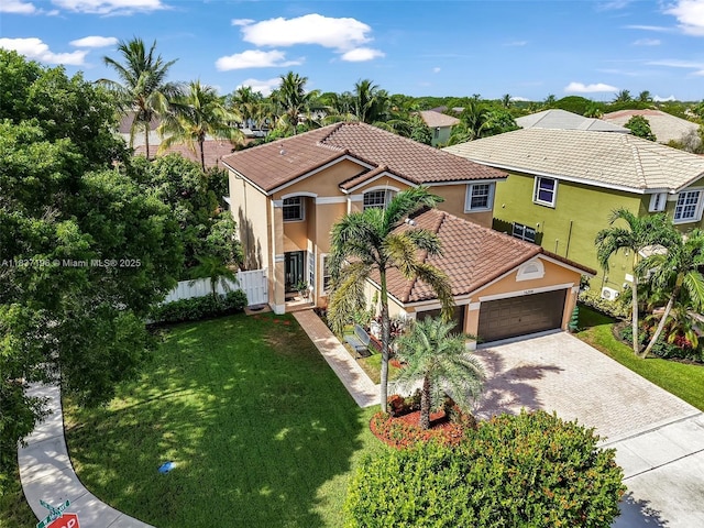 16204 SW 18th Pl, Miramar, FL 33027 - mediterranean / spanish-style home with stucco siding, a tile roof, decorative driveway, and a garage