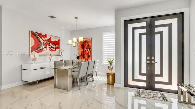 16204 SW 18th Pl, Miramar, FL 33027 - dining area with light marble finish floors and a chandelier