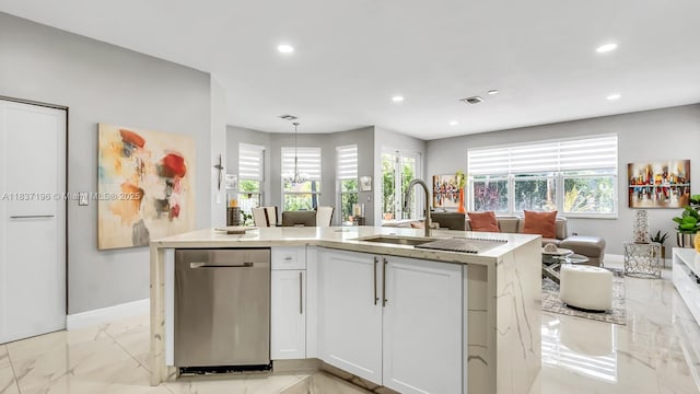 16204 SW 18th Pl, Miramar, FL 33027 - kitchen with light marble finish floors, recessed lighting, open floor plan, a center island with sink, and white cabinetry
