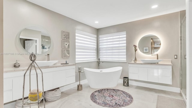 16204 SW 18th Pl, Miramar, FL 33027 - full bath with two vanities, a freestanding tub, and recessed lighting