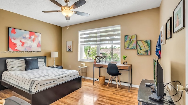 16204 SW 18th Pl, Miramar, FL 33027 - bedroom with wood finished floors, an office area, and a ceiling fan