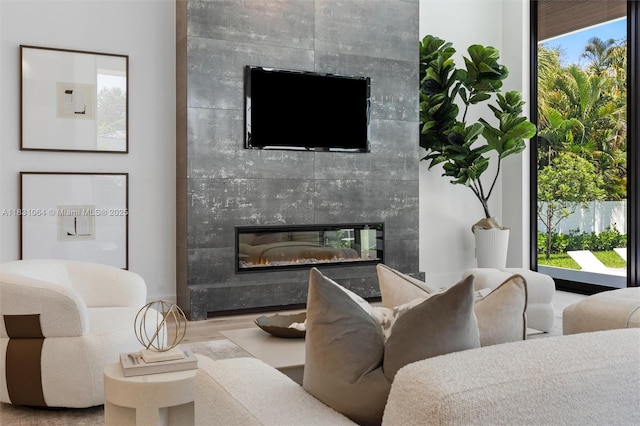 416 NW 24th St, Wilton Manors, FL 33311 - living room featuring a high end fireplace and wood finished floors