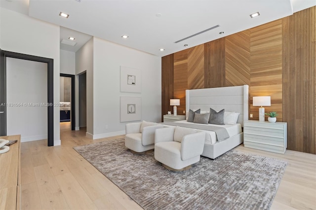 416 NW 24th St, Wilton Manors, FL 33311 - bedroom with light wood finished floors, recessed lighting, and an accent wall
