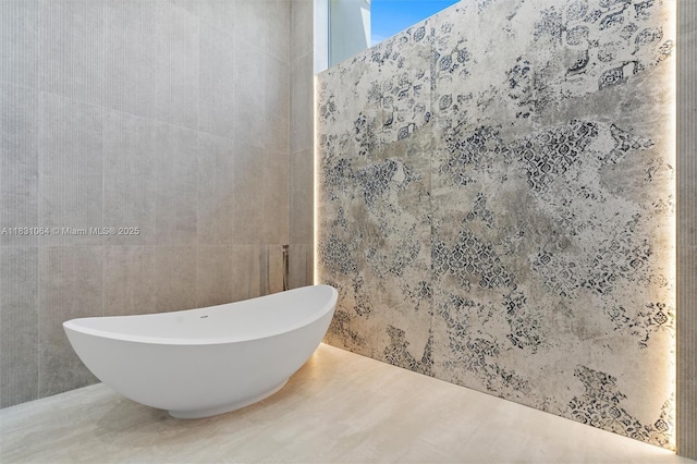 416 NW 24th St, Wilton Manors, FL 33311 - bathroom with a freestanding bath and tile walls