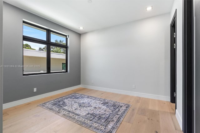 416 NW 24th St, Wilton Manors, FL 33311 - unfurnished room featuring wood finished floors and recessed lighting