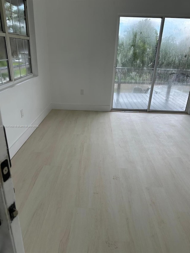 420 Burning Tree Ln, Punta Gorda, FL 33982 - empty room featuring wood finished floors and baseboards