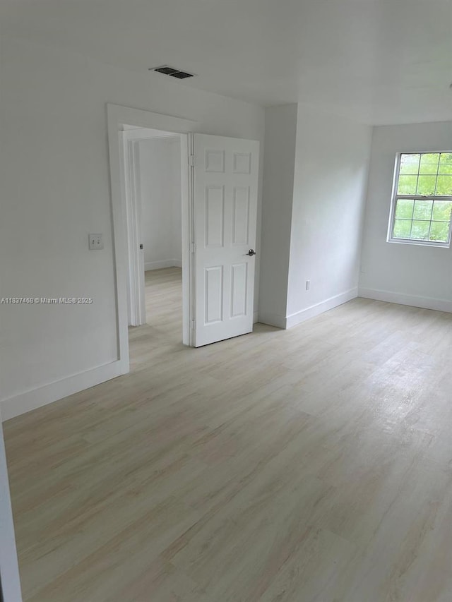 420 Burning Tree Ln, Punta Gorda, FL 33982 - spare room with light wood-style flooring and baseboards