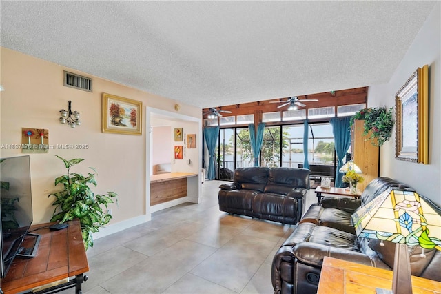 1512 NW 113th Way, Pembroke Pines, FL 33026 - living room with ceiling fan, a textured ceiling, and light tile patterned floors