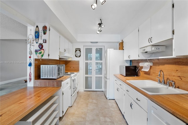 1512 NW 113th Way, Pembroke Pines, FL 33026 - kitchen featuring under cabinet range hood, white appliances, white cabinetry, light tile patterned floors, and french doors
