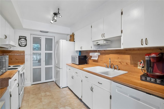 1512 NW 113th Way, Pembroke Pines, FL 33026 - kitchen featuring white appliances, under cabinet range hood, white cabinetry, light countertops, and french doors