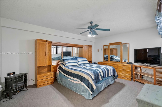 1512 NW 113th Way, Pembroke Pines, FL 33026 - bedroom with a wood stove, light colored carpet, a textured ceiling, and a ceiling fan