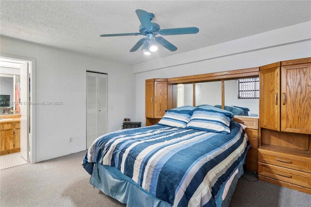 1512 NW 113th Way, Pembroke Pines, FL 33026 - bedroom with light colored carpet, a closet, a textured ceiling, ceiling fan, and ensuite bathroom