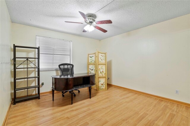 1512 NW 113th Way, Pembroke Pines, FL 33026 - home office with wood finished floors, ceiling fan, and a textured ceiling