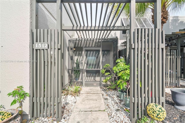 1512 NW 113th Way, Pembroke Pines, FL 33026 - entrance to property with a gate, stucco siding, and a pergola