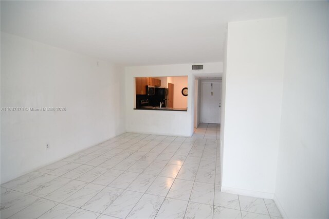 20825 NE 8th Ct Unit 203-19, Miami, FL 33179 - empty room featuring light marble finish flooring