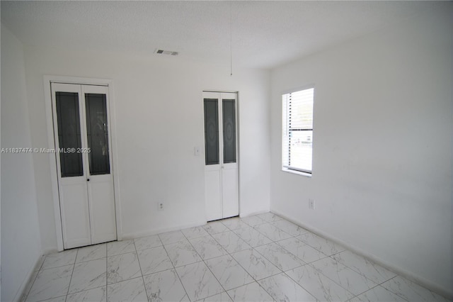 20825 NE 8th Ct Unit 203-19, Miami, FL 33179 - unfurnished room featuring light marble finish flooring and baseboards