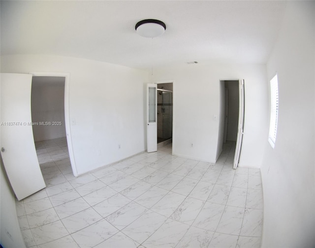 20825 NE 8th Ct Unit 203-19, Miami, FL 33179 - unfurnished bedroom with light marble finish flooring