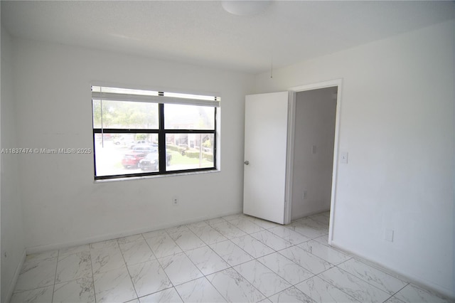 20825 NE 8th Ct Unit 203-19, Miami, FL 33179 - empty room with light marble finish floors
