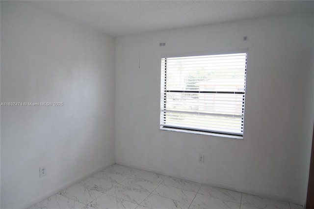 20825 NE 8th Ct Unit 203-19, Miami, FL 33179 - unfurnished room with baseboards and marble finish flooring