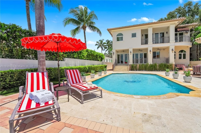 66 S Hibiscus Dr, Miami Beach, FL 33139 - foyer entrance featuring arched walkways, a chandelier, marble tiled floors, stairway, and ornamental molding