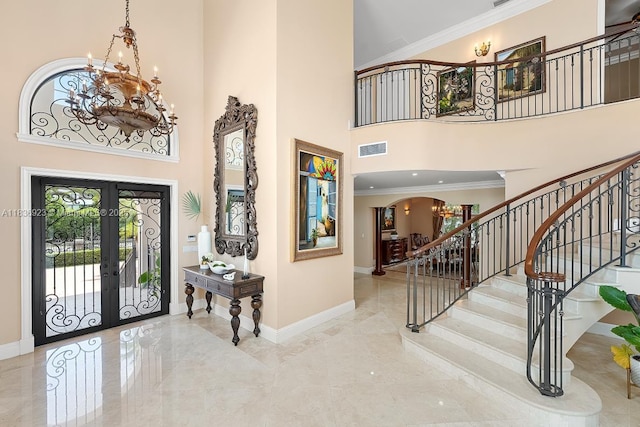 66 S Hibiscus Dr, Miami Beach, FL 33139 - living room with ornate columns, a tray ceiling, arched walkways, a ceiling fan, and crown molding