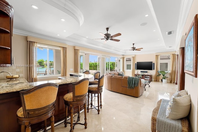 66 S Hibiscus Dr, Miami Beach, FL 33139 - indoor wet bar featuring backsplash, arched walkways, crown molding, a ceiling fan, and recessed lighting