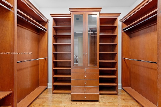 66 S Hibiscus Dr, Miami Beach, FL 33139 - bedroom with light wood finished floors, a tray ceiling, ornamental molding, recessed lighting, and a ceiling fan
