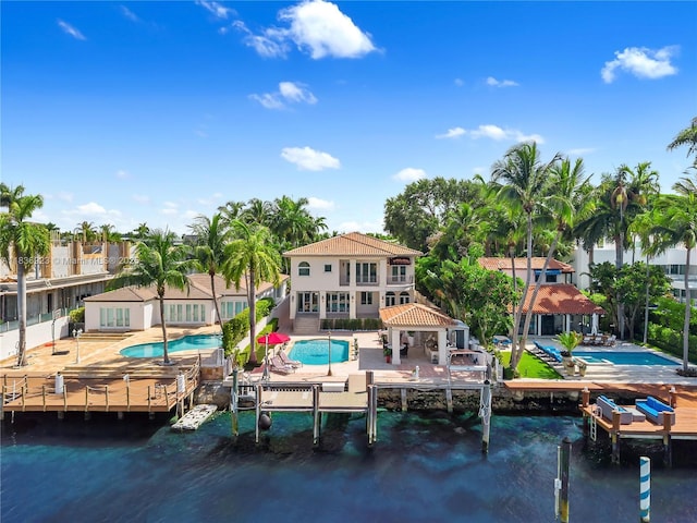66 S Hibiscus Dr, Miami Beach, FL 33139 - dock area featuring a gazebo, an outdoor pool, a water view, and a patio