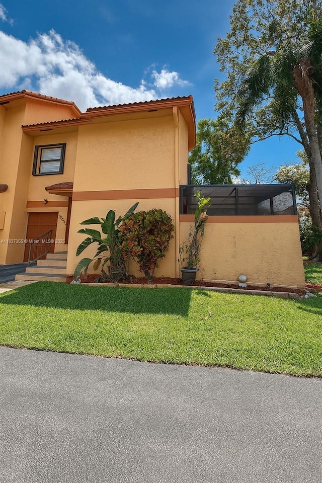 11236 SW 11th St, Pembroke Pines, FL 33025 - view of side of home featuring stucco siding and a yard