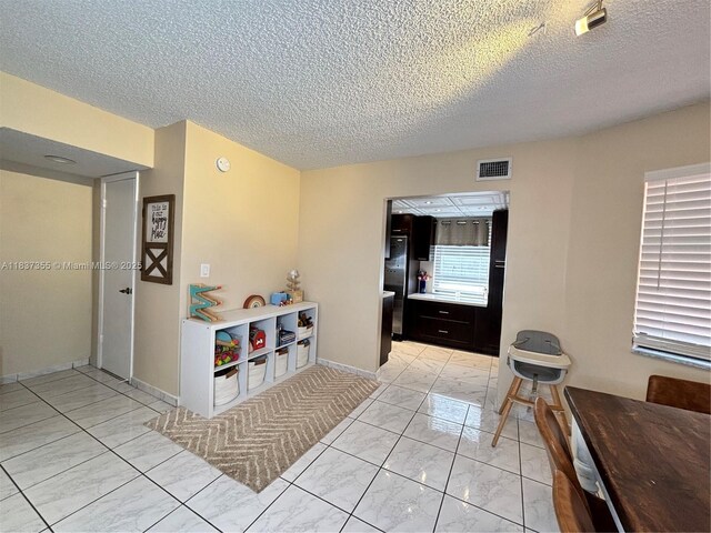 11236 SW 11th St, Pembroke Pines, FL 33025 - hallway featuring light marble finish floors and a textured ceiling