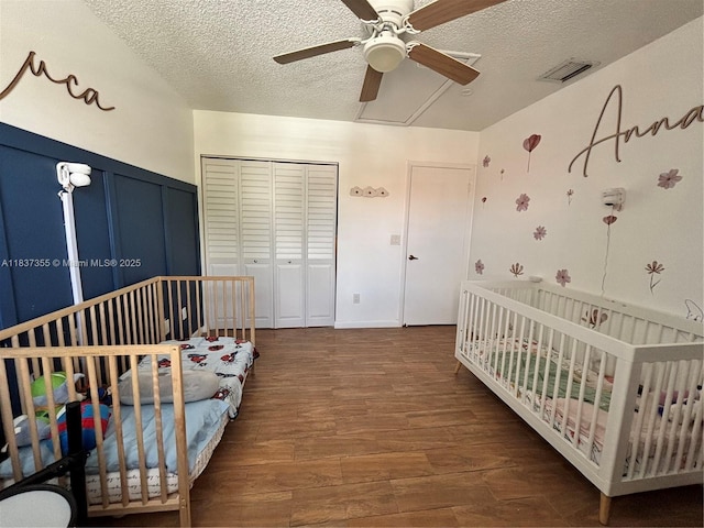 11236 SW 11th St, Pembroke Pines, FL 33025 - bedroom featuring a closet, wood finished floors, a textured ceiling, a nursery area, and a ceiling fan
